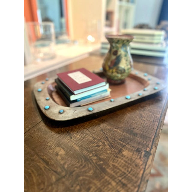 A Beautifully patinated copper tray with metal edging and inlay 'bead' like detailing. The tray has a lot of character and...