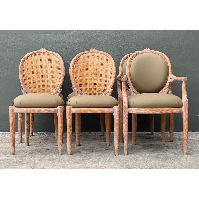 This magnificent set of six vintage carved faux bois dining chairs exhibits a masterful imitation of natural wood grain,...