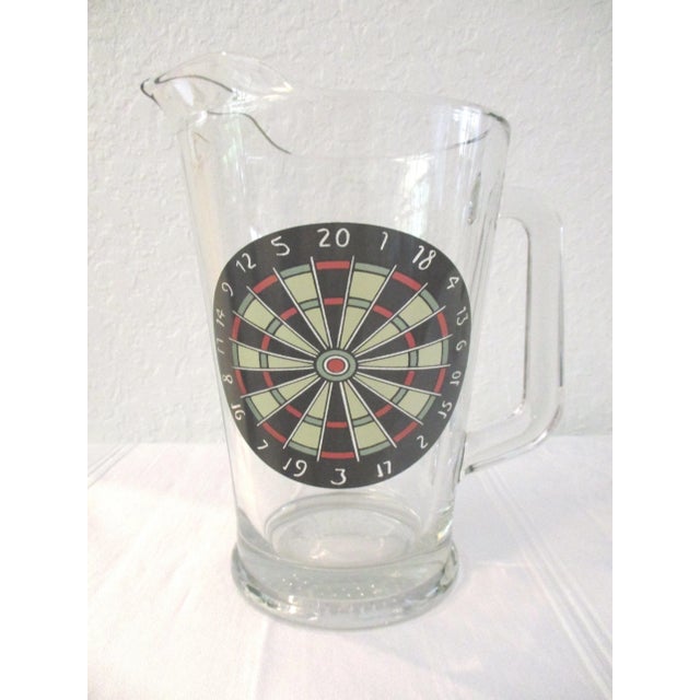 Perfect for the man cave. Large clear glass pitcher and four pint glasses featuring a dartboard motif on face. Excellent...