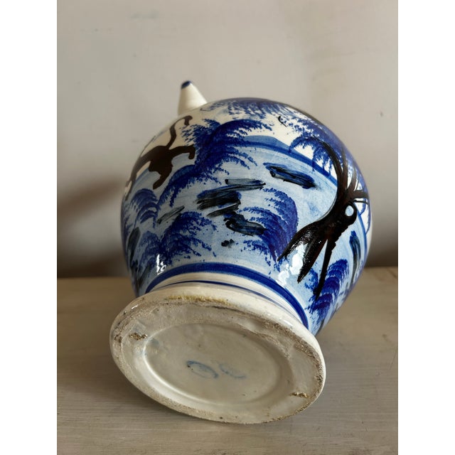 Vintage Spanish blue & white jug / water pitcher vessel. Handpainted featuring palm trees and a monkey.