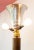 Unsigned. A large and high quality floor lamp made with different materials, such as wood, brass, gilt metal (the large...
