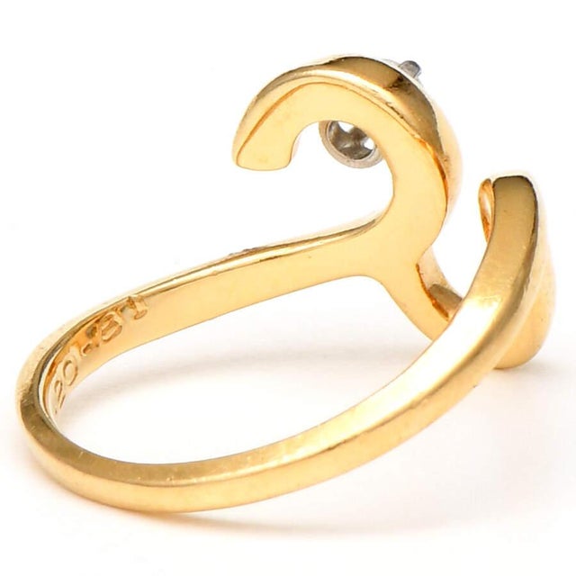 This 14-karat yellow-gold free-form ring is sure to enchant your significant other or loved one. It features a stunning...
