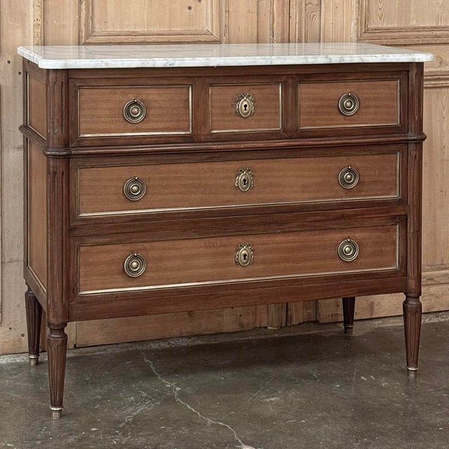 Antique French Louis XVI Mahogany Commode with Carrara Marble will make an elegant addition to any decor! Crafted from...