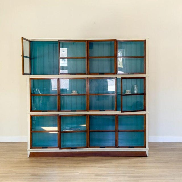 A striking architect bookcase, handcrafted by roche bobois, offered in its original condition. The bookcase is composed of...