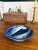Striking vintage studio pottery bowl featuring a dramatic cobalt blue glaze with flowing white abstract forms reminiscent...