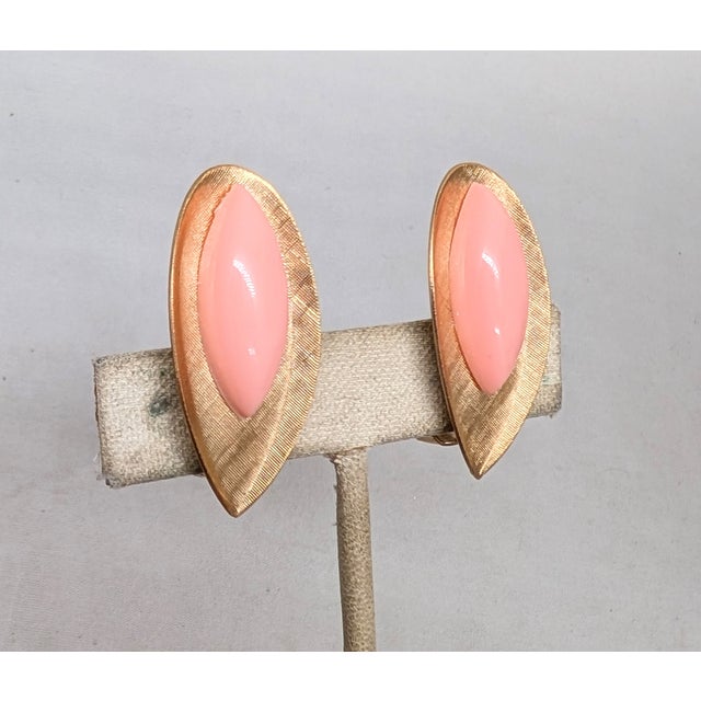 1950s oblong oval with pointed bottom with marquise cabochon shaped pink resin centers butterfly clip back earrings....