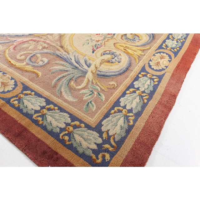This exquisite French Savonnerie rug from the early 20th century epitomizes classical elegance and refined European...