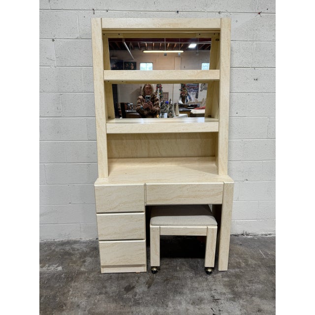 How cute is this desk and stool! Faux travertine look laminate finish two piece desk with top that rests on desk with...
