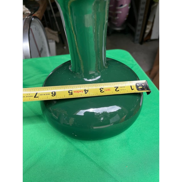 Up for consideration is a beautiful vintage ceramic emerald green vase. This would look lovely in your home, and it is the...