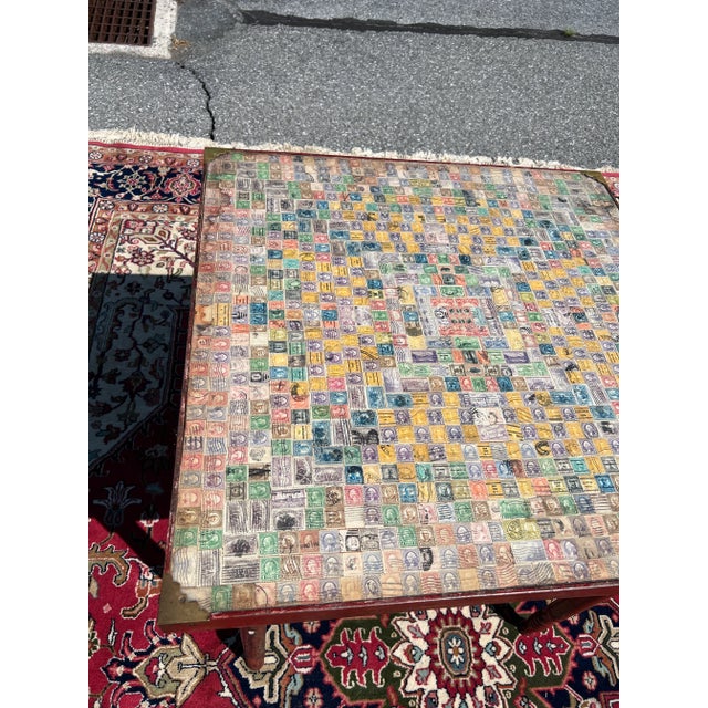 An Antique Pennsylvania Folk Art Postage Stamp Decoupage Game Table, 1938 Signed in pencil on the underside: “Made by R....