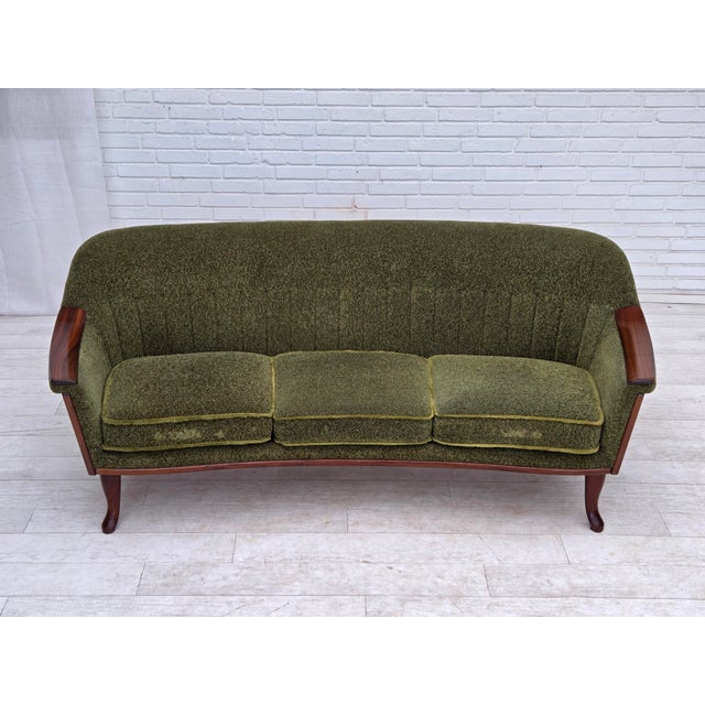 1970s, Scandinavian vintage 3-seater sofa. Original green furniture fabric, teak wood legs and armrests. Springs in the...
