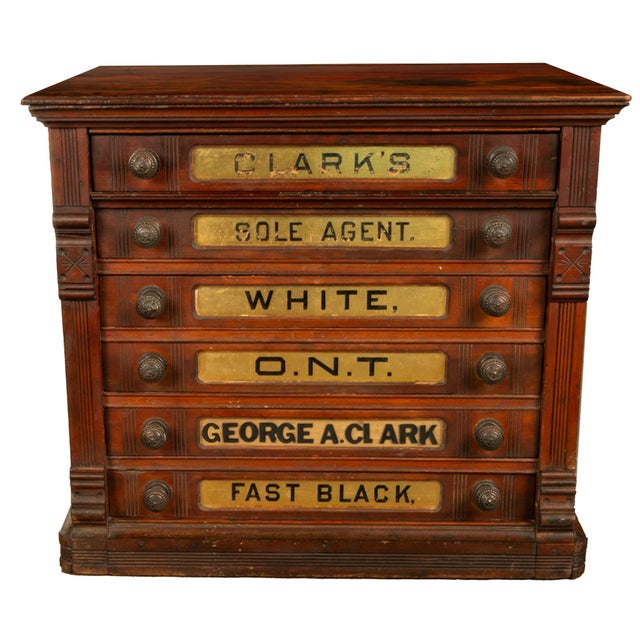A distinctive piece of late 19th-century American "country store" advertising furniture, carved in the Eastlake style....