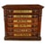 A distinctive piece of late 19th-century American "country store" advertising furniture, carved in the Eastlake style....
