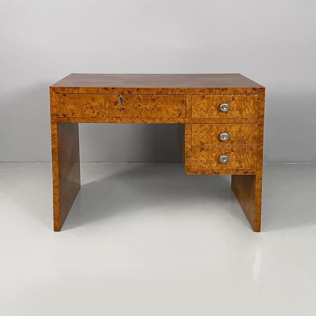 Italian Art Desk desk in wood and steel, 1930s Desk in briar wood. Under the rectangular top, there are a column of three...