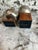 Stylish set of two Roost decorative bud vases featuring softly brushed silver-tone metal vessels mounted on warm wood...
