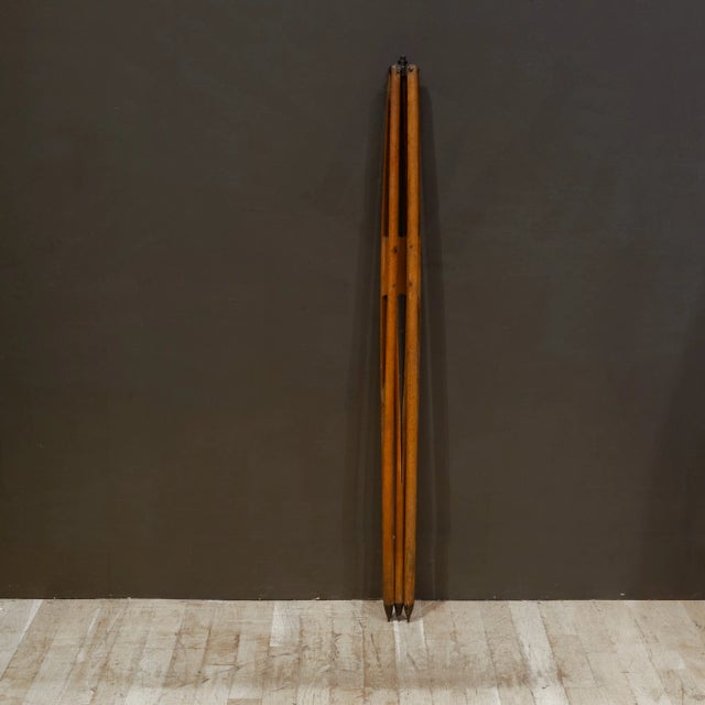 ABOUT Vintage wooden surveyor's transit scope tripod with painted feet and metal top. CREATOR Possibly Dietzgen. DATE OF...