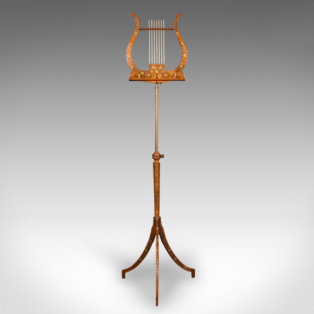 This is an exceptional antique music recital stand. An English, walnut and boxwood articulated stand dating to the Regency...