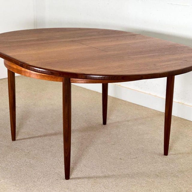 Elevate your dining space with this exquisite circular dining table , designed by Viktor Wilkins and meticulously...