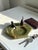 A beautifully sculptural mid-century European vide-poche or decorative catchall featuring two stylized bronze ducks...