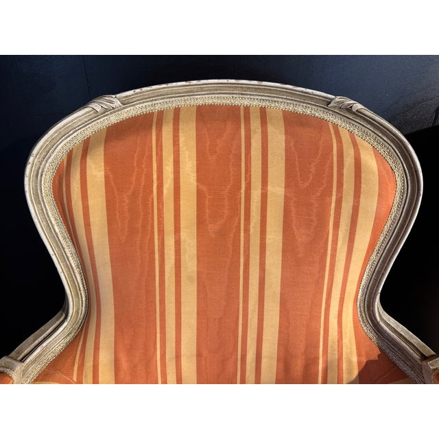 A nice pair of Comfortable Bergere Arm Chairs. The frames are strong and sturdy and retain their original finish. The...