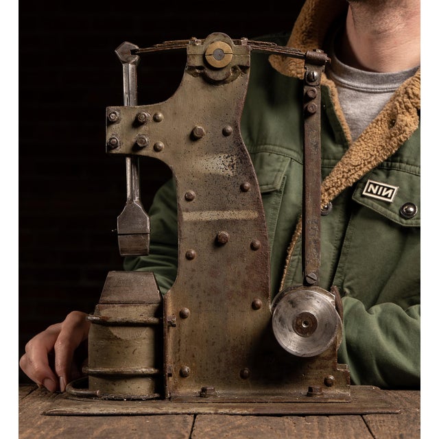 Compact mechanical salesman's model of a power hammer, built from riveted steel plate and fitted with a working linkage...