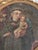 17th century oil painting on canvas of a monk holding baby Jesus in the style of the Renaissance.Presented in a gilt wood...