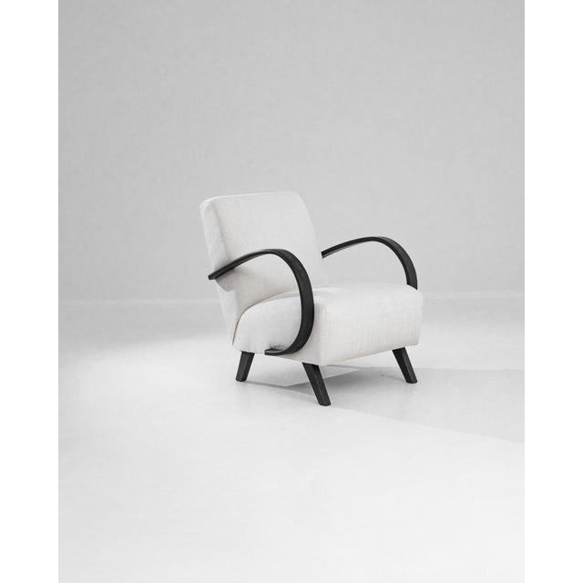 Add a touch of Art Deco elegance to your home with this stunning 1950s Czech Wooden Armchair by J. Halabala. Renowned for...
