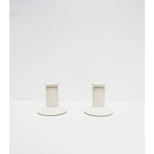 A vintage pair of white ceramic 'column' candlestick holders, circa 1960s-1970s, Portugal. Both marked on bottom as show...