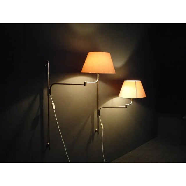 Two brass wall lamps by Florian Schulz 1960s. Both lamps have an articulated arm. They are height adjustable and can be...