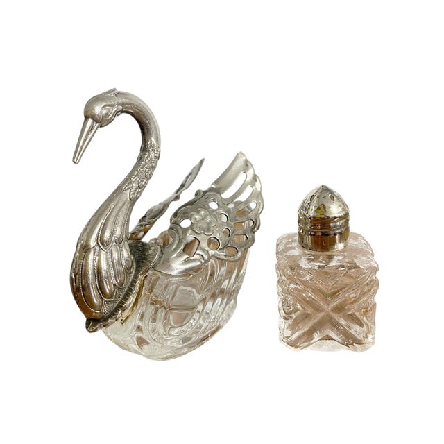 Set of three vintage shakers and a container . The set includes a ruby glass piece with bakelite top (4.5" H × 2" D), a...