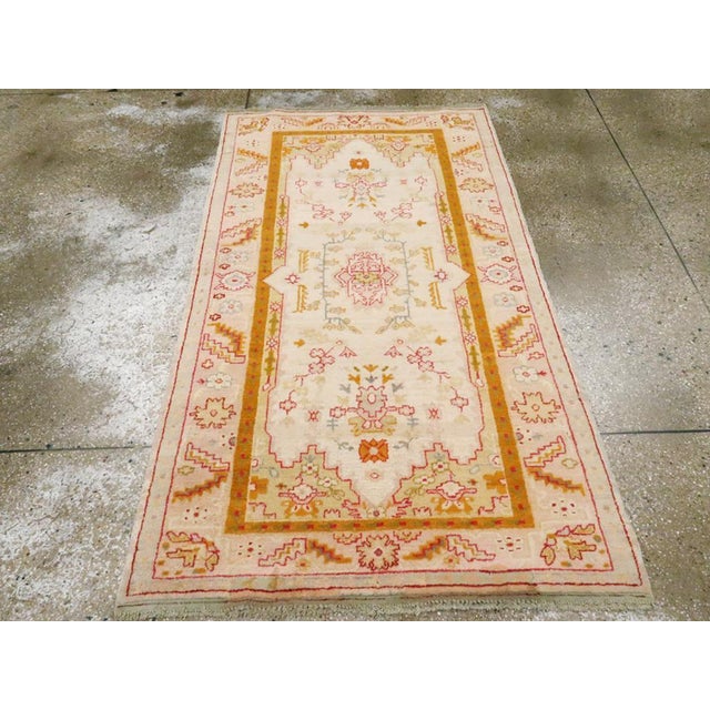 An antique Turkish Oushak accent rug handmade during the Early 20th century. Measures: 3' 6" x 6' 3"