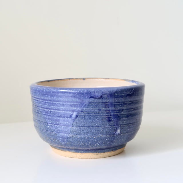 Hand-thrown studio pottery bowl by ceramic artist Howard Fields. This rounded footed bowl features a rich cobalt-to-...