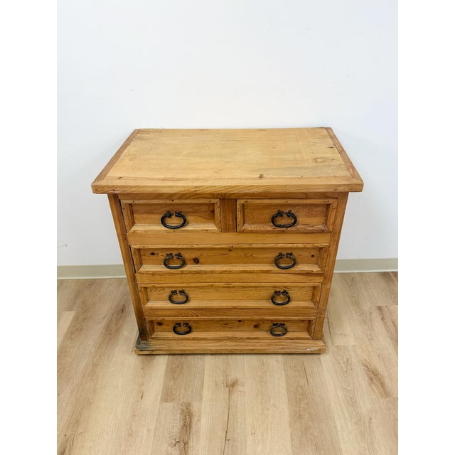 This handsome solid Mexican pine five drawer dresser is a well-built and characterful rustic farmhouse find. Crafted in...