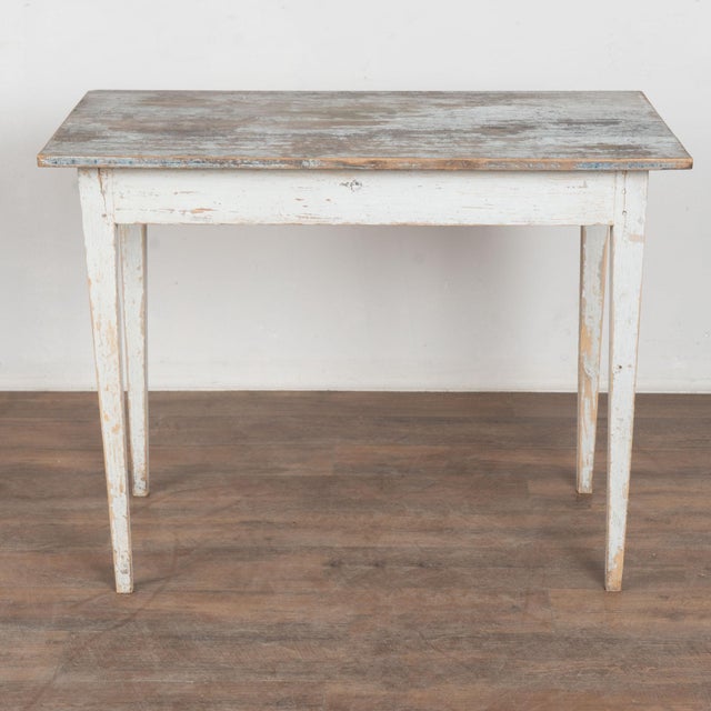 19th century Swedish side table, crafted in pine and retaining its original painted finish. The table has simple lines...