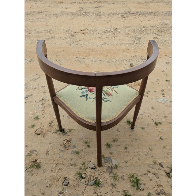 Antique needlepoint corner chair. Sturdy and unique chair. Good condition. A few imperfections. Beautiful chair!!