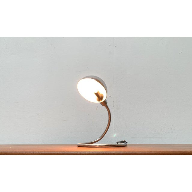 Space Age Snake Lamp in chrome. A classic from the 60/70s. The lamp is adjustable in almost every position via the...