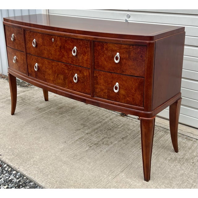 Buffet by Thomasville of their Bogart collection. Features a highly figured mahogany & maple burl veneers with inlaid...