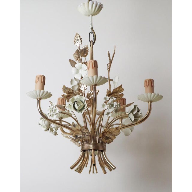 This beautiful Italian chandelier is truly special, adorned with a stunning bouquet of roses and bellflowers, making it a...