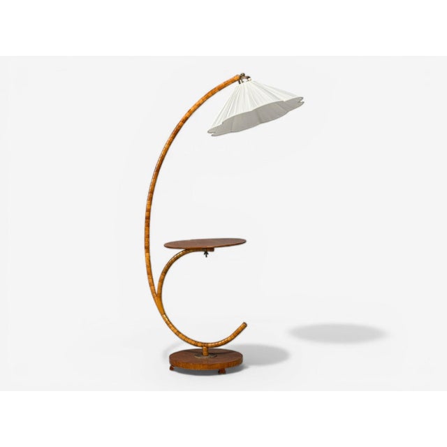 Swedish Mid-Century Modern, Floor Lamp with Shelf, Birch, Brass, Sweden, 1930s A wonderful floor lamp designed and...
