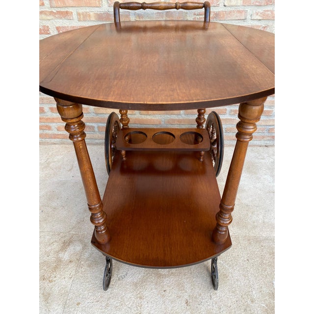 This French style serving cart is a stunning piece of furniture that will add a touch of elegance to any room. The cart is...