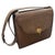 An Elegant 1970s Brown Leather and Brass Hardware Shoulder Bag by Gucci. This is a sophisticated 1970s Gucci shoulder bag,...