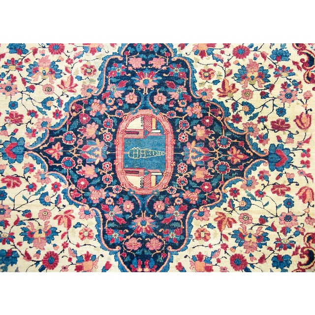 An incredible early 20th century Persian Tehran rug with a large central medallion with a single cypress tree between two...