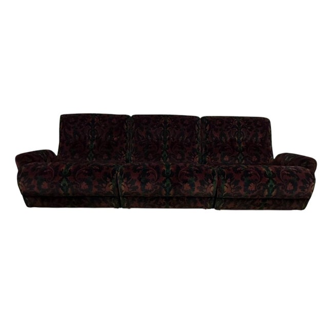 This is a unique sofa and chair set, having patterned velvet fabric upholstery and an interesting silhouette with...
