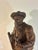 A finely hand-carved antique Black Forest figure depicting a bearded hunter accompanied by his loyal dog. Rich with...