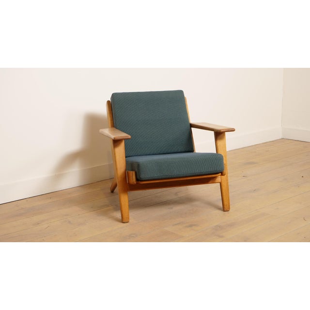 Designed by Hans Wegner, this beautiful vintage armchair is marked on the frame. The iconic plank chair will complete your...