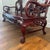 Exceptional Chinese carved hardwood three-seat settee featuring three natural Dali dreamstone marble panels, dating to the...