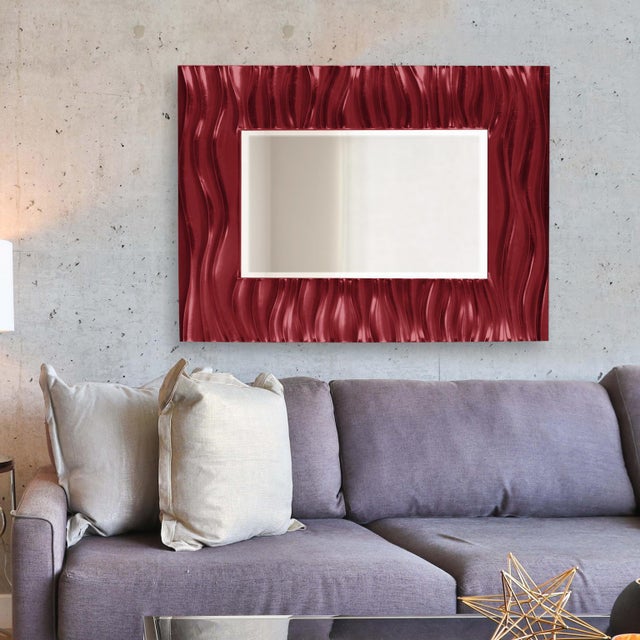 Our Zenith Mirror features a rectangular frame that is characterized by a deep textured wave design. The waves give an...