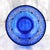 This is a footed blue cut to clear vase or bowl in an interesting shape. It looks like a large juice glass and only the...
