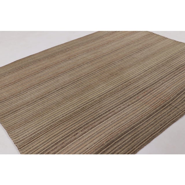 Handwoven in wool, this 7x9 contemporary Kilim is part of Rug & Kilim’s signature “Rez Kilim” collection, an exploration...