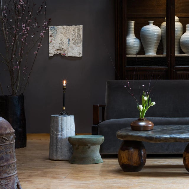 This unusual squat vessel would have been kept near a Kang platform to warm one's blankets before bed. Much like a hot...